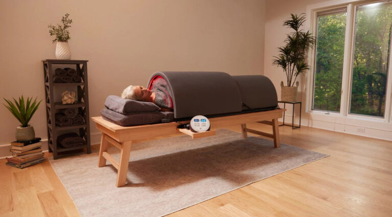 Person relaxing in an infrared sauna for thyroid support and detoxification.