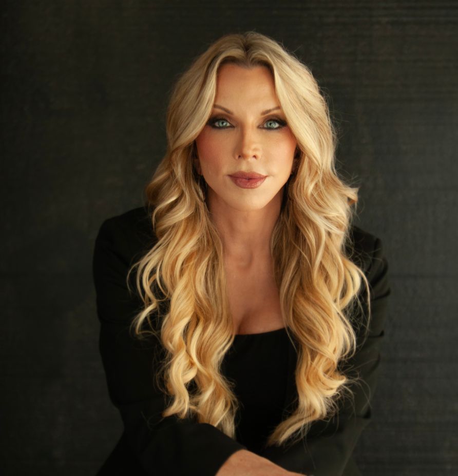 Dr. Amie Hornaman, health expert and founder of The Institute for Thyroid and Hormone Optimization, with long blonde hair and a black blazer, promoting thyroid health and wellness.